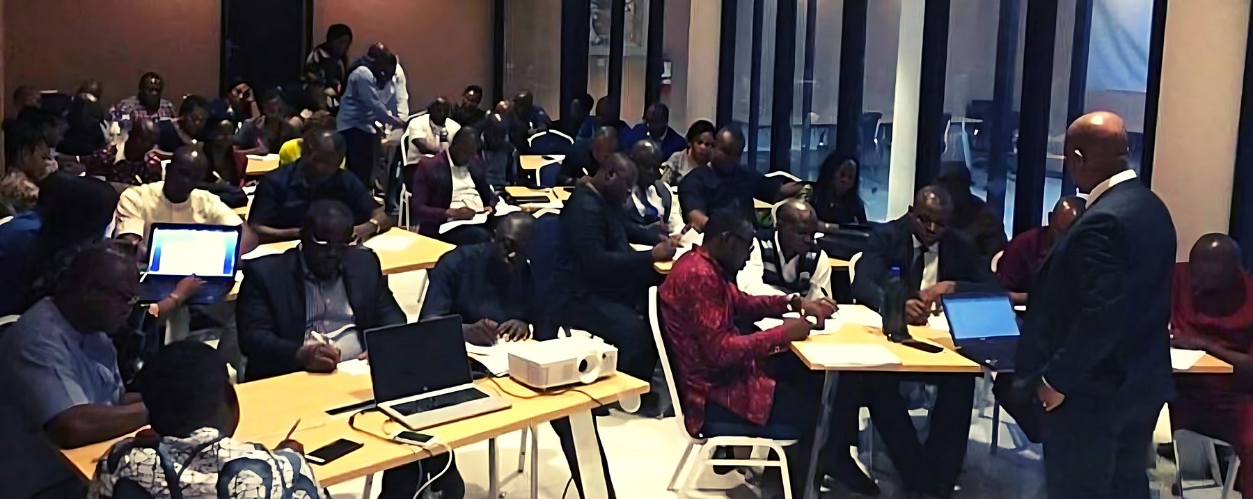 Chuba Nkala teaching a full training room of professionals
